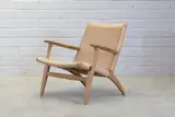 Oak 'CH25' armchair by Hans J. Wegner, 1949, sold Jan 2025