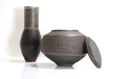 Jason Wason, Studio pottery lidded vessel, in black with white incised bands to the collar and a pewter band to the rim
