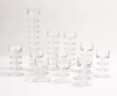Ronald Stennett-Willson, Set of twelve 'Sheringham' glass candlesticks, c.1970, in clear glass