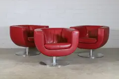 Jeffrey Bernett, Set of three 'Tulip' armchairs, c.2000, each with red leather upholstery