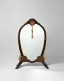 Rare 'Psyche' Mirror by Carlo Bugatti, copper, pewter, walnut, vellum, and bone, offered Jun 2024