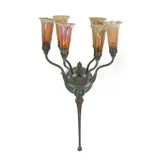 Six-Light Lily Wall Sconce by Tiffany Studios, Favrile glass, patinated bronze, one shade etched 'L, sold Mar 2024
