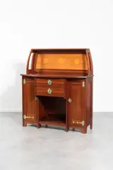 Vaisselier by Gustave Serrurier-Bovy, 1900, Mahogany, brass hinges and handles and brass-rimmed earthenware cabochons, opening with two drawers and two doors (four , offered Dec 2023