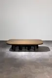 Ado Chale, Goutte d'eau, Une table basse en bronze sur pieds laqués noirs
