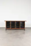 Jules Wabbes, Bibliothèque basse, Solid padauk with four lucite doors and slate shelves, on gun-barrel steel base