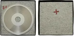 Joseph Beuys, Sun Disc, 1973, Record matrix (nickel-plated copper) with die-cut hole, felt pads stamped with brown paint, in box,