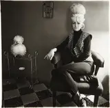 Lady bartender at home with a souvenir dog, New Orleans by Diane Arbus, 1964, Gelatin silver print, printed later by Neil Selkirk, sold Apr 2013
