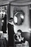 Upstairs at Maxim’s, Paris by Helmut Newton, 1978, Gelatin silver print from Private Property Suite II, printed 1984, sold Oct 2013