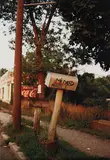 Mildred Phillips mailbox by William Eggleston, 1971, Dye transfer print, sold Oct 2013