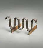 Jean Royere, "Ondulation" andiron, circa 1950, Wrought iron