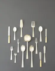 Tétard Frères, "Trocadero" flatware service for twelve, circa 1925, Silver, stainless steel, ivory. Comprising 12 dinner forks, 12 luncheon forks, 11 salad forks, 12 shrimp forks, 12 soup spoons, 12 dinner spoons, 12 dinner knives, 11 luncheon knives, 12 butter knives, cheese knife, serving spoon, serving fork, cake server, ladle and fish server (112)