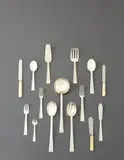 Tétard Frères, "Trocadero" flatware service for twelve, circa 1925, Silver, stainless steel, ivory. Comprising 12 dinner forks, 12 luncheon forks, 11 salad forks, 12 shrimp forks, 12 soup spoons, 12 dinner spoons, 12 dinner knives, 11 luncheon knives, 12 butter knives, cheese knife, serving spoon, serving fork, cake server, ladle and fish server (112)