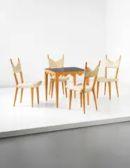 Jean Royere, Important "Ondulation" table and set of four "Baltique" side chairs, 1950s, Table: sycamore, slate; chairs: sycamore, fabric