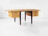 Rare curved "Bureau Standard," model no. BS by Jean Prouvé, 1943, Oak-veneered wood, oak, painted steel, sold Dec 2013