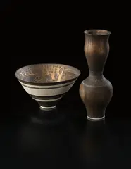 Lucie Rie, Deep conical bowl, circa 1982, Porcelain, golden manganese glaze with bands of inlaid and sgraffito grid designs