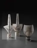 "Cycladic" arrow form by Hans Coper, circa 1972, Stoneware, layered white porcelain slips and engobes over a body with textured and incised linear designs, the interior , sold Dec 2013