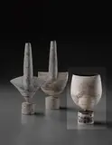 "Cycladic" pot with spherical volume and oval lip by Hans Coper, circa 1974, Stoneware, layered white porcelain slips and engobes over a body with textured and incised linear designs, the interior , sold Dec 2013
