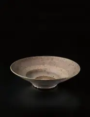 Large open form bowl by Lucie Rie, circa 1960, Stoneware, flowing "Dolomite" glaze with an unglazed ring in the well, sold Dec 2013