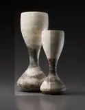 Early and large "Hourglass" form by Hans Coper, 1965, Stoneware, layered white porcelain slips and engobes over a body with textured and incised linear designs, the interior , sold Dec 2013