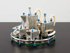 "Piazza" tea and coffee service by Michael Graves, designed 1984-1985, produced 1991, Silver, faux ivory, lacquered aluminum, Bakelite, sold Dec 2013