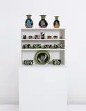Group of seventeen “Town Wares,” from the “Easter Island” series on a replica “Town Unit,” circa 1977 by Ken Price, Glazed ceramic. Together with later replica “Town Unit” case, offered Dec 2013