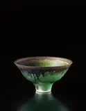 Footed bowl by Lucie Rie, circa 1978, Porcelain, bottle green glaze with golden lip, sold Dec 2013