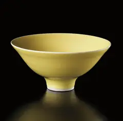 Footed bowl by Lucie Rie, circa 1974, Porcelain, "American" yellow glaze, sold Dec 2013