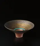 Footed bowl by Lucie Rie, circa 1980, Porcelain, golden manganese glaze, turquoise rings, terracotta foot and well, sold Dec 2013