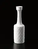 Rare bottle with raised dots by Lucie Rie, circa 1976, Porcelain, squared body, matte white glaze, sold Dec 2013