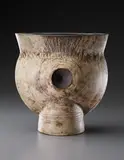 Early and large "Thistle" form by Hans Coper, circa 1958, Stoneware, layered white porcelain slips and engobes over a body with textured and incised linear designs, the interior , sold Dec 2013
