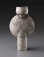 Hans Coper, Composite form with vertical central disc, circa 1972, Stoneware, layered white porcelain slips and engobes over a body with textured and incised linear designs, the interior with manganese glaze