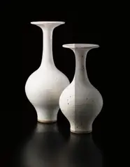 Lucie Rie, Large bottle vase with flaring lip, circa 1978, Stoneware, shiny white glaze with manganese brown speckle