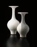 Large bottle vase with flaring lip by Lucie Rie, circa 1978, Stoneware, shiny white glaze with manganese brown speckle, sold Dec 2013