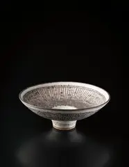 "Knitted" bowl by Lucie Rie, circa 1982, Stoneware, inlaid with manganese beneath grey, sold Dec 2013