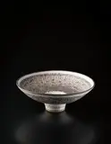 "Knitted" bowl by Lucie Rie, circa 1982, Stoneware, inlaid with manganese beneath grey, sold Dec 2013