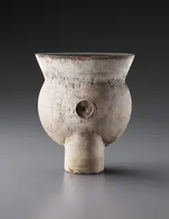 Early "Thistle" form by Hans Coper, circa 1958, Stoneware, layered white porcelain slips and engobes over a body with textured and incised linear designs, the interior , sold Dec 2013