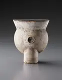 Early "Thistle" form by Hans Coper, circa 1958, Stoneware, layered white porcelain slips and engobes over a body with textured and incised linear designs, the interior , sold Dec 2013