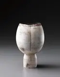 Hans Coper, Composite form with vertical impression, circa 1969, Stoneware, layered white porcelain slips and engobes over a body with textured and incised linear designs, the interior with manganese glaze