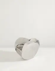 “Rolling Volume” chair by Ron Arad, circa 1991, Mirror polished stainless steel, sold Dec 2013
