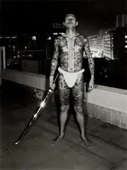 Seiji Kurata, A Tattooed Man: Ikebukuro, Rooftop of the Bungeiza Building from Flash Up, 1975, gelatin silver print