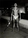 Seiji Kurata, A Tattooed Man: Ikebukuro, Rooftop of the Bungeiza Building from Flash Up, 1975, gelatin silver print