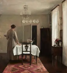 Carl Holsøe, Artist's Wife Setting Table (Kunstnerens hustru dækker bordet), oil on canvas