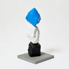 Ugo Rondinone, small black white blue mountain, 2025, painted stone and stainless steel on artist's base