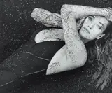 Herb Ritts, Tatjana with Black Sand, Hawaii, 1987, gelatin silver print, mounted