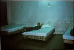 Brian in hotel room with three beds, Merida, Mexico. 1982 by Nan Goldin, 1982, dye destruction print, mounted, sold Jun 2026