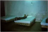 Nan Goldin, Brian in hotel room with three beds, Merida, Mexico. 1982