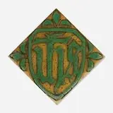 Tile with Christian iconography (IHS) by Addison LeBoutillier for Grueby Faience Company, c. 1915, glazed earthenware, sold Jan 2025