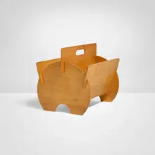 Magazine rack by Modern, c. 1960, birch plywood, sold Oct 2025