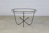 Edward Ihnatowicz, 'Atom' coffee table, 1950s, the circular glass top supported on a wrought steel base