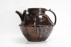 Large Winchcombe Pottery stoneware teapot by Michael Cardew, finished in a tenmoku glaze, sold Oct 2024